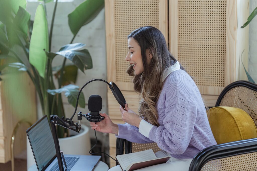 Image of woman on podcast in hotel showcasing influencer marketing for hotels 