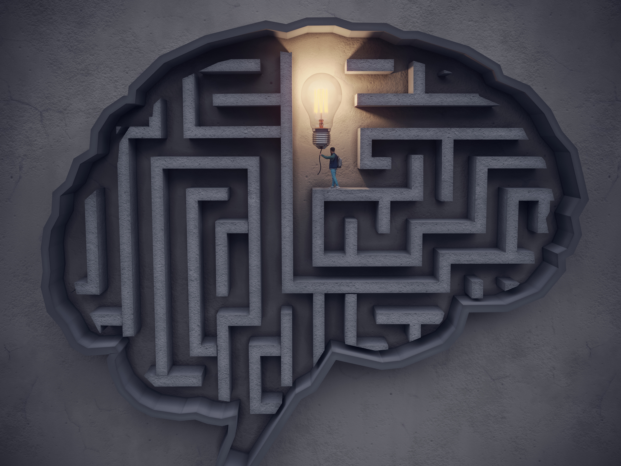 Big Idea Concept, The man turns on the lightbulb in the maze-shaped brain